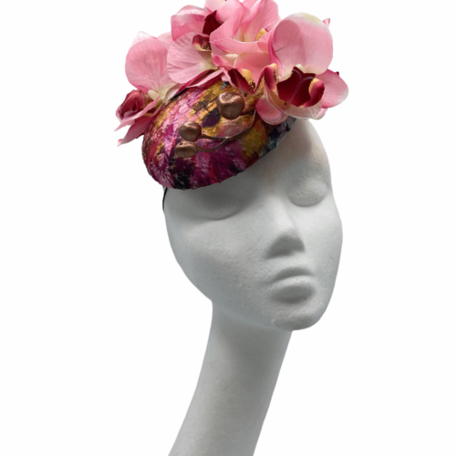 Multicoloured but primarily pink headpiece with orchid flower to the front and finished with rose gold buds.