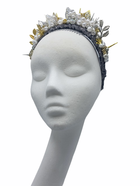 Grey headband crown with gold and silver embellishment.