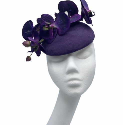 Purple felt headpiece with matching purple orchid detail to finish.