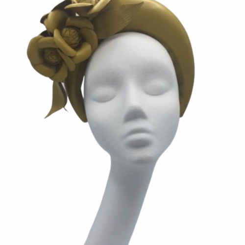 Mustard leather crown with leather flower detail.
