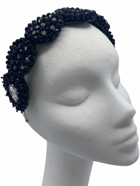Hand beaded crown with black band.