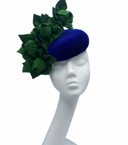 Cobalt blue velvet headpiece with green handmade flower detail.