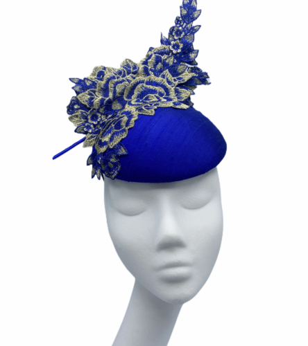 Cobalt blue headpiece with gold structured embellishment.