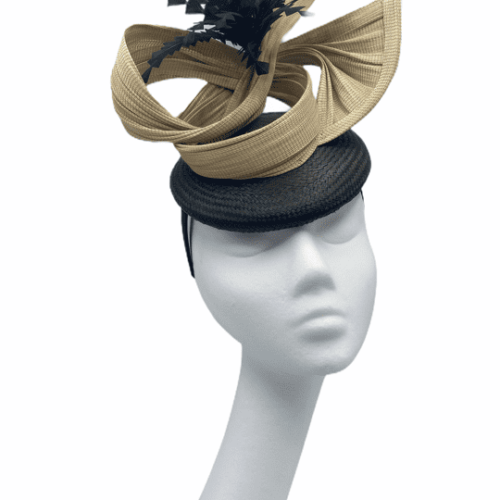 Dark olive green base with beige swirl and a spray of black feathers.