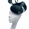 Forest green velvet headpiece with swirl detail.