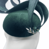 Forest green velvet headpiece with swirl detail.