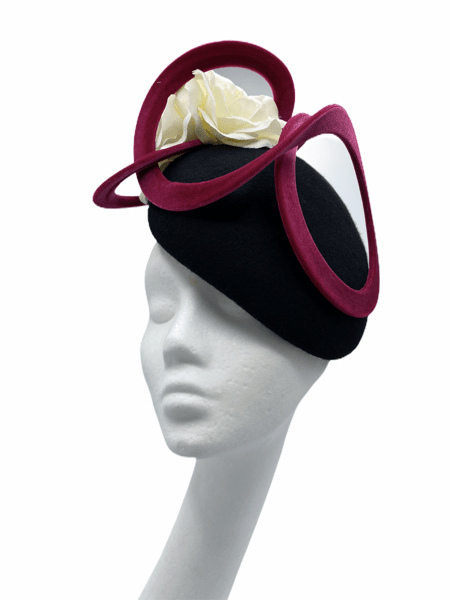 Stunning black felt beret headpiece with berry coloured loops and beautiful ivory flower detail.