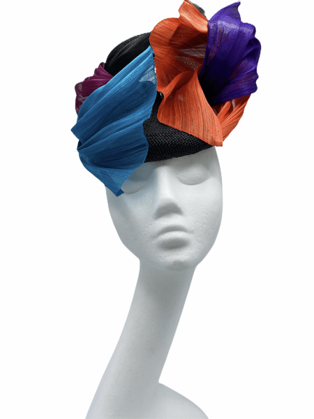 Black base headpiece with an array of silk abaca coloured detail to finish in pink, teal, purple and orange.
