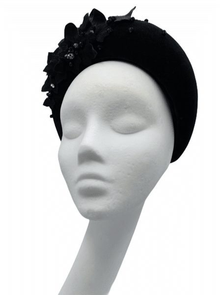 Stunning black cotton velvet halo crown, embellished with leather leaves and beaded detail.