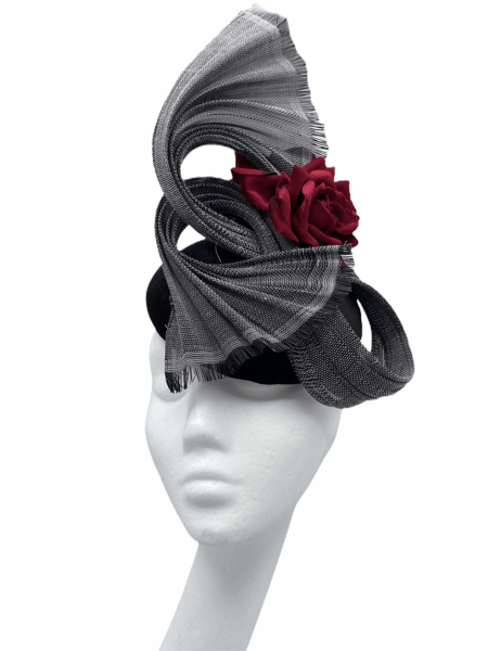 Black base headpiece with grey swirl detail and finished with a wine flower.