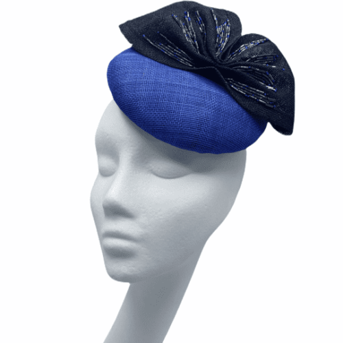 Blue base headpiece with french navy bow with hand sewn navy beads.
