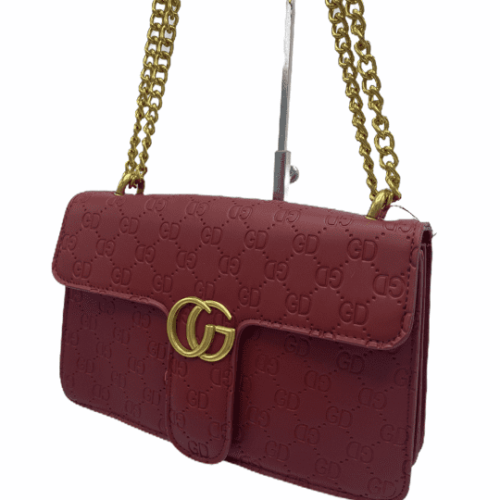 Burgundy red designer inspired handbag with gold chain/hardware detail.