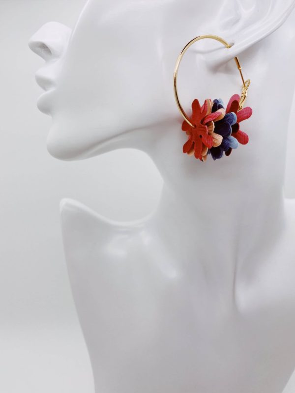 Gold hoop earrings with coloured flower detail.