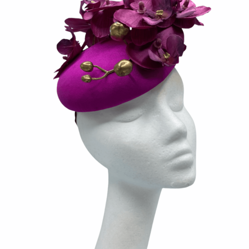 Pink magenta coloured headpiece with pink magenta orchids and gold buds.