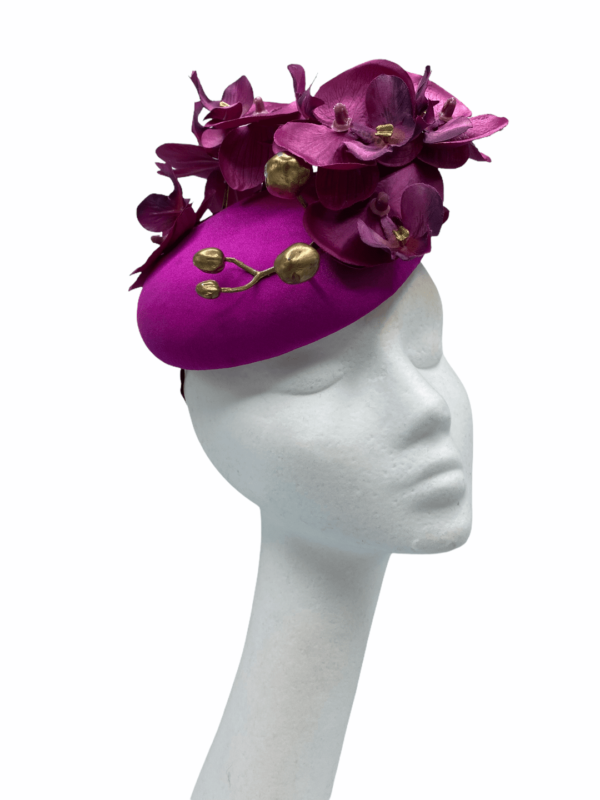 Pink magenta coloured headpiece with pink magenta orchids and gold buds.