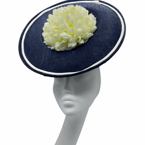 Navy frontal saucer percher with ivory trim and lemon/ivory flower to the centre.