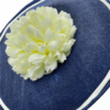 Navy frontal saucer percher with ivory trim and lemon/ivory flower to the centre.