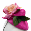Pink raw silk headpiece with flower detail to top and finished with green leaf.