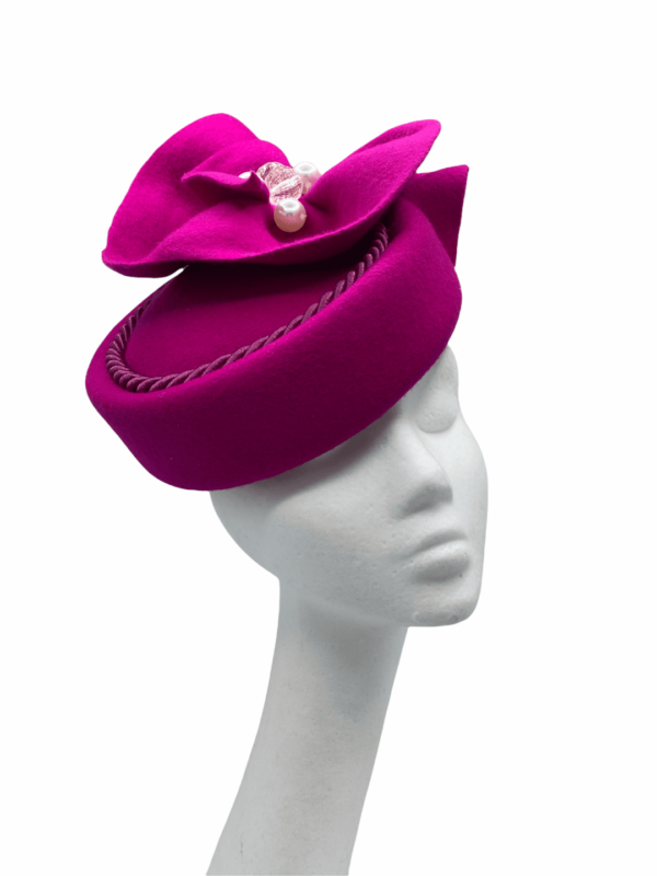 Pink felt Jackie Onassis inspired headpiece with stunning rope piping detail.
