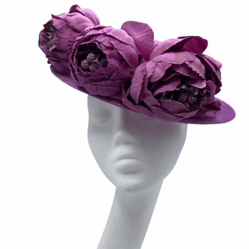 Beautiful pink boater headpiece with stunning flower detail.