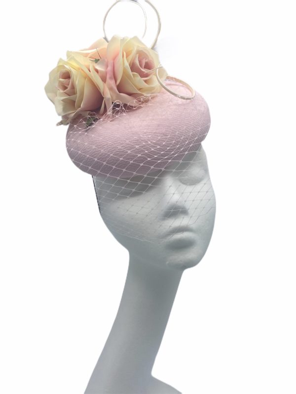 Stunning powder pink pillbox with flowers and face veil detail to finish.