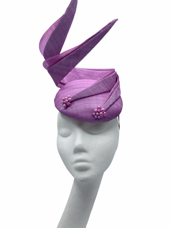 Stunning lilac pink structured headpiece.