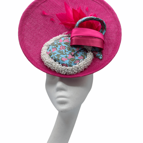 Pink percher headpiece with light blue and pink centre with matching swirls and  surrounded with pearl detail.