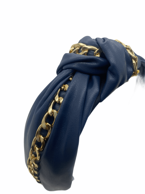 Navy faux leather headband with gold chain detail.