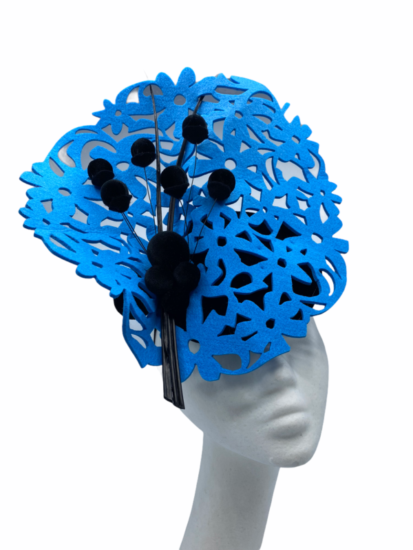 Blue disc laser cut headpiece with black base and black quill detail.