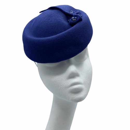 Navy blue felt pillbox with lovely subtle detail to the top of the headpiece.