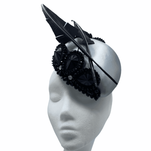 Silver metallic teardrop with stunning black embellished detail with black arrow head feathers.