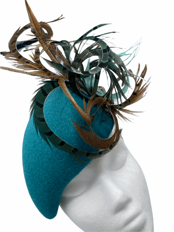 Very smart teal felt feather headpiece, quite an unusual shape and stunning on.