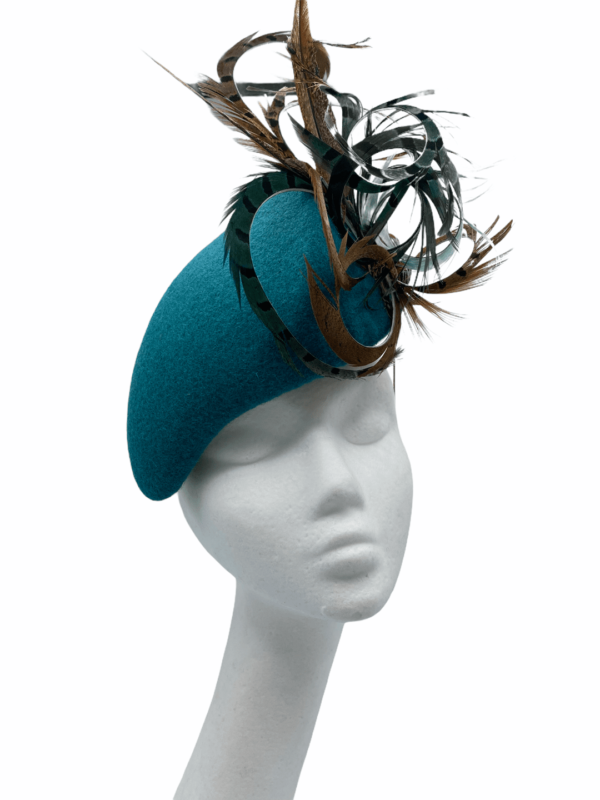Very smart teal felt feather headpiece, quite an unusual shape and stunning on.