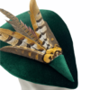 Stunning forest green velvet  percher with dramatic feather detail, finished with a twist to the back of the headpiece.