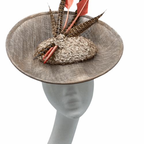 Large taupe percher with sequin centre, finished with orange arrow head feathers.