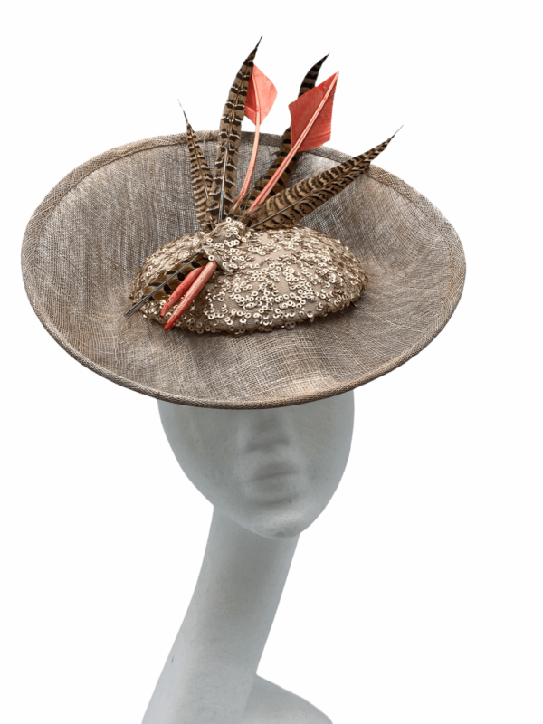 Large taupe percher with sequin centre, finished with orange arrow head feathers.