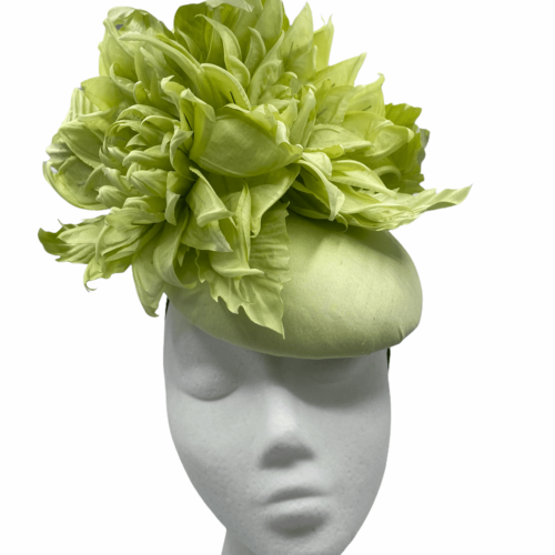 Light green satin headpiece with stunning dramatic flower detail.