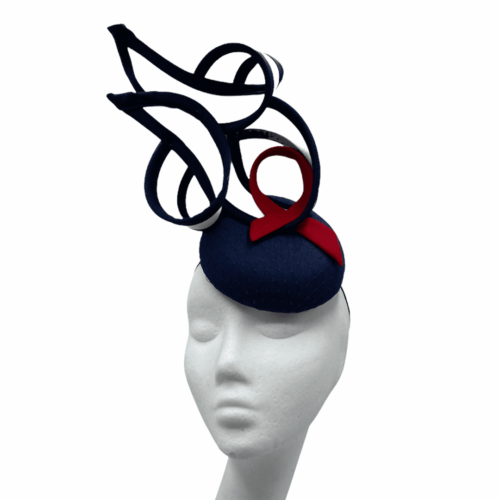 Stunning navy, white and red structured headpiece. Base size is small.