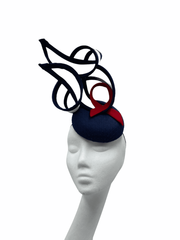 Stunning navy, white and red structured headpiece. Base size is small.