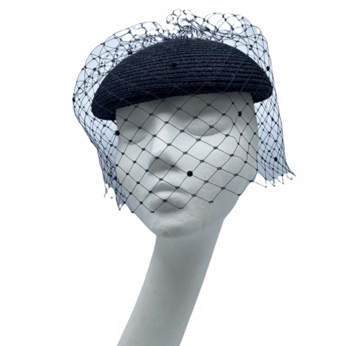 Stunning navy cap shaped base headpiece with stunning full face navy veiling.