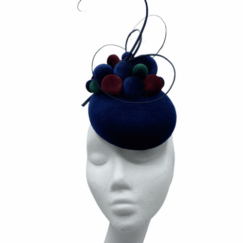 Stunning small navy velvet headpiece with forest green, navy and burgundy ball detail.