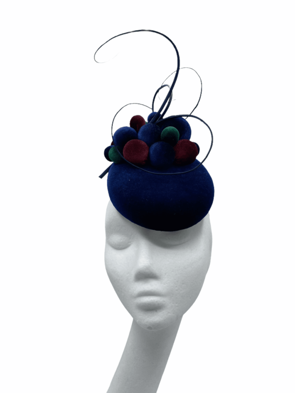 Stunning small navy velvet headpiece with forest green, navy and burgundy ball detail.