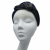 Stunning knotted navy crown with yellow gold thread detail throughout. 