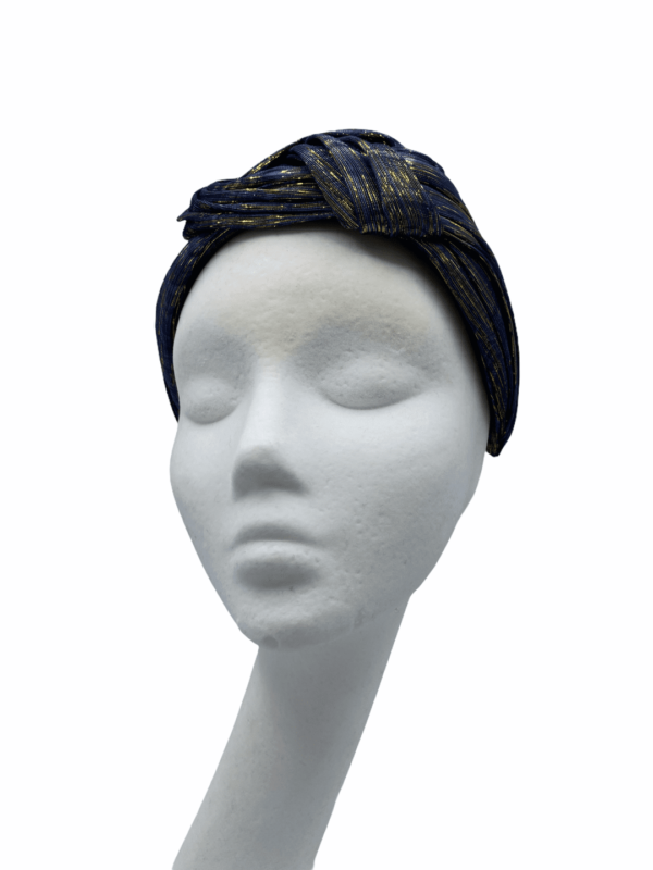 Stunning knotted navy crown with yellow gold thread detail throughout. 