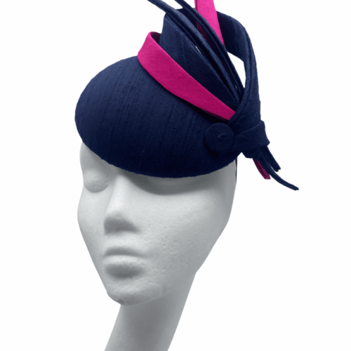 Stunning navy headpiece with pink and navy swirl detail.