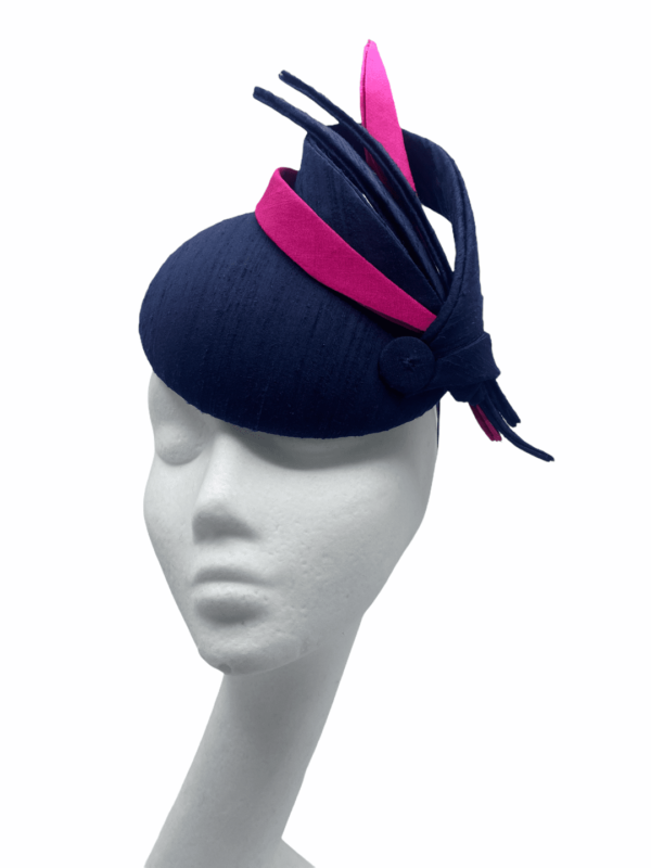 Stunning navy headpiece with pink and navy swirl detail.