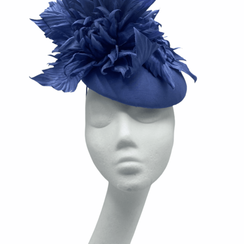 Stunning blue/light navy headpiece with raw silk base and matching raw silk flower detail.
