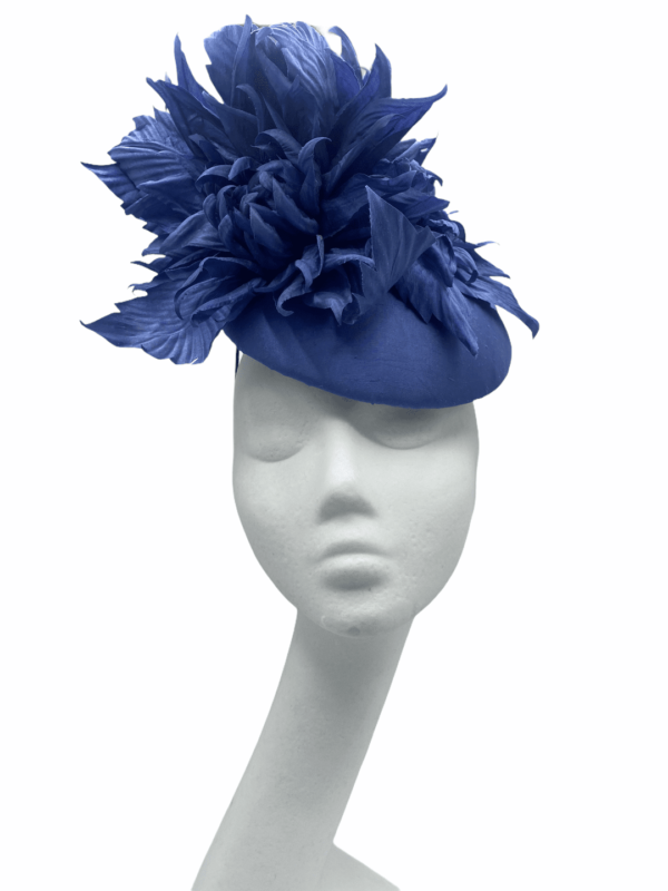 Stunning blue/light navy headpiece with raw silk base and matching raw silk flower detail.