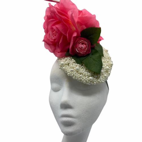 Pearl encrusted button headpiece with stunning pink flower and green leaf detail.