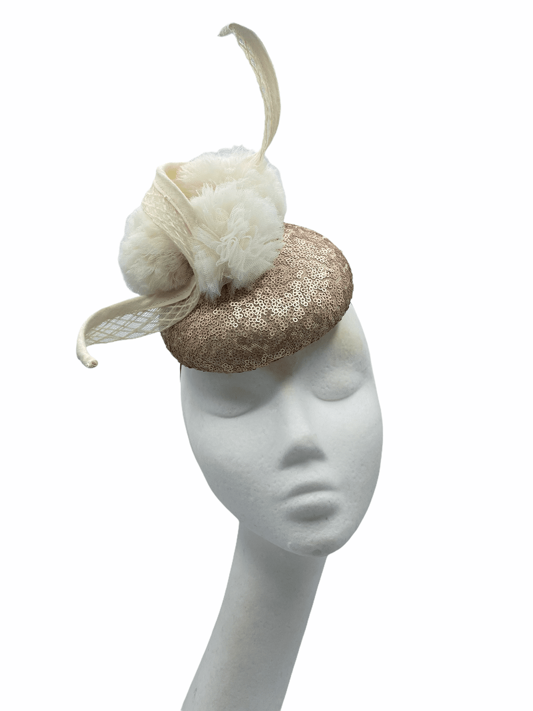 Small button rose gold sequinned headpiece with cream pom pom detail and cream swirl detail to finish.